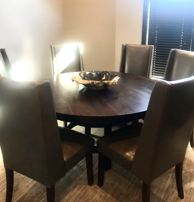 dining room wood table and leather chairs 