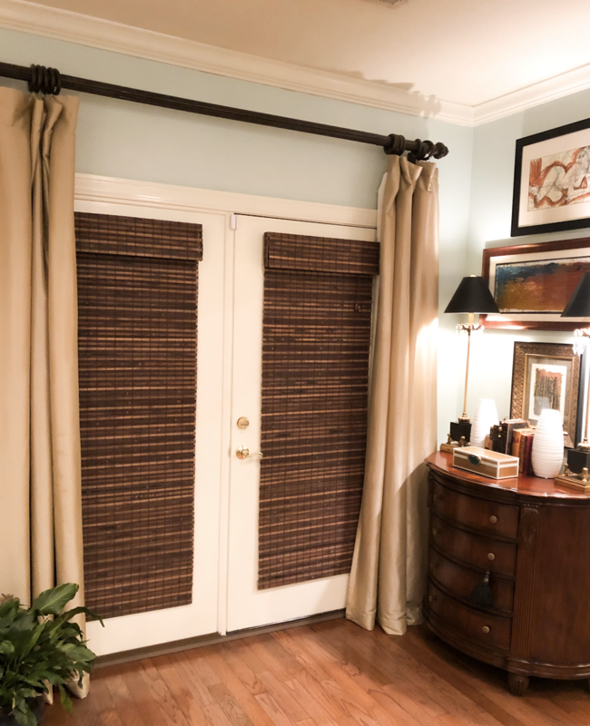Natural woven wood shades with a privacy liner for living room doors