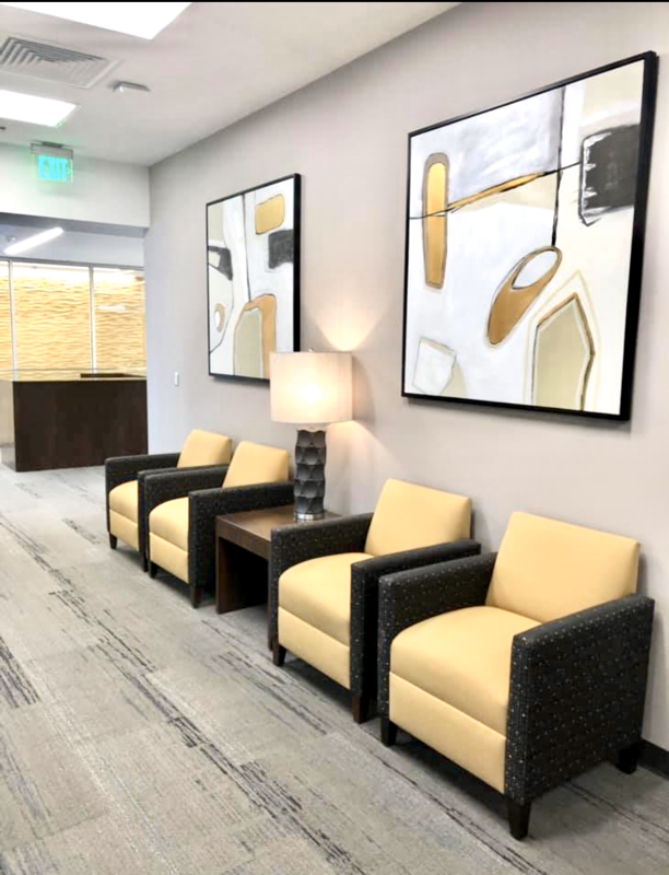 Commercial interior Design for a bank waiting area with artwork and lamps 