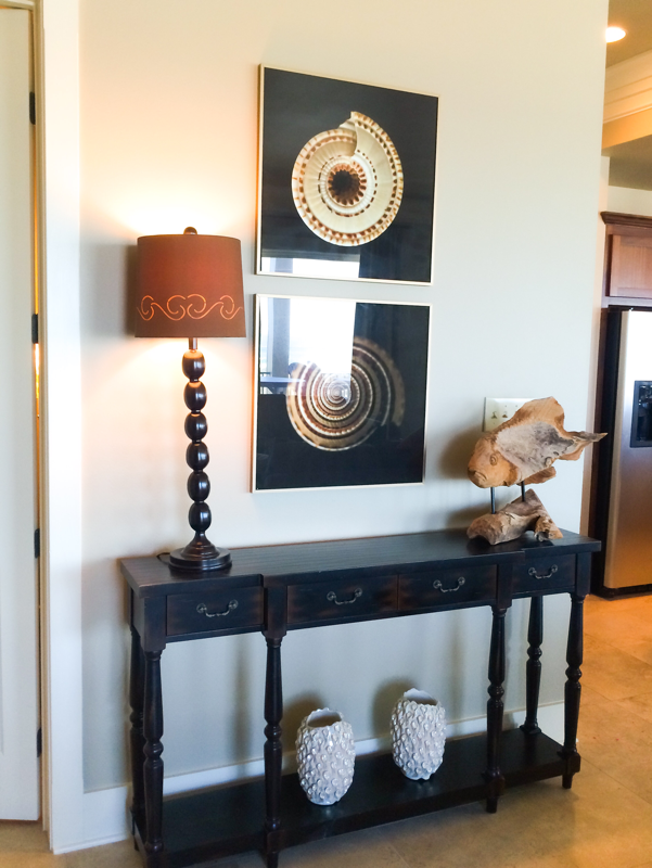 sofa table and two black shell art and brown lamp design